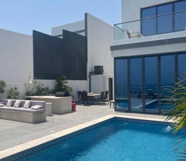 Al Dhaid Villa | سحر المحيط لتأجير بيوت العطلات ocean magic luxury 4BR villa with privet pool, direct sea view,sharm-Al Dana Villa, Al Dana island by ocean magic holiday homes