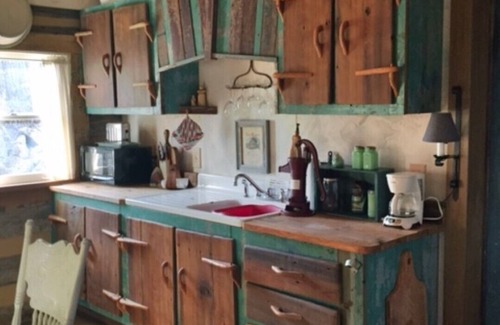 Madison Cabin | 1800’s restored log cabin on 26 private rolling wooded acres with sunset views