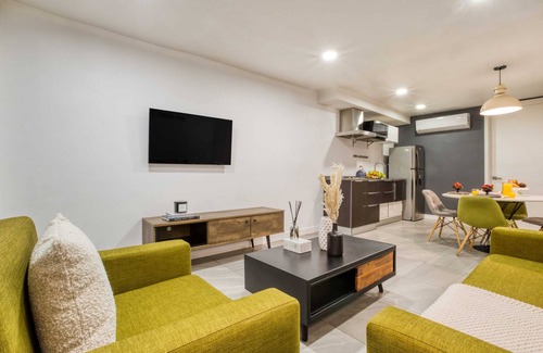 Centro Apartment | 2BR Apt w/Balcony: Gym, Rooftop+Fire Pit, Lounge/Games