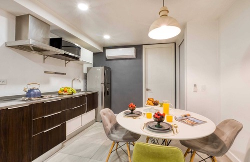 Centro Apartment | 2BR Apt w/Balcony: Gym, Rooftop+Fire Pit, Lounge/Games
