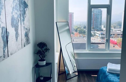 Central Lonsdale Apartment | 360º Rooftop Patio Views. Your-Home-Away-From-Home