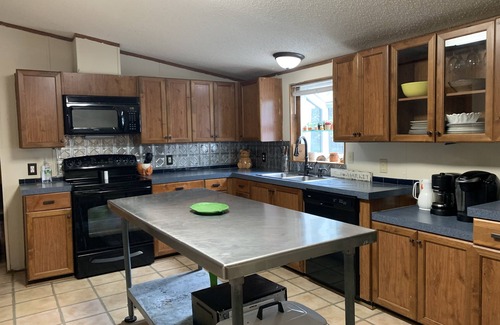 Roxboro House | 5 bdrm, 3 full bth, large living room and fireplace area.