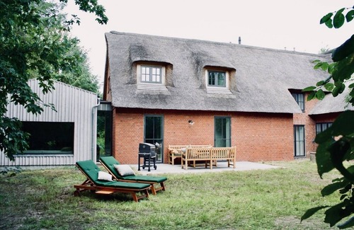 Rodenas House | 5* thatched roof house Ziegelmacher Achten 6600sqm natural garden with pond and outdoor sauna