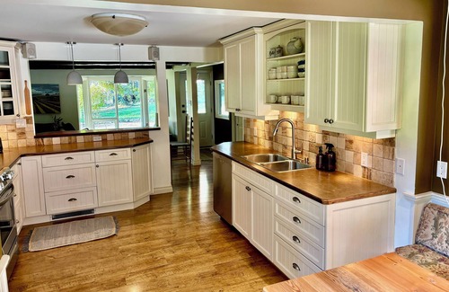 Courtenay House | A charming country home, nestled among fir trees. Close to the ocean.