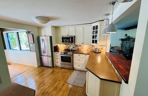 Courtenay House | A charming country home, nestled among fir trees. Close to the ocean.