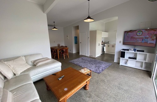 Manly House | A Kiwi beachside holiday a couple of minutes walk to the sand .