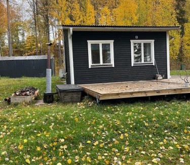 Grythyttan House | A simple stuga on a lake incinerating toilet in a separate building next to the cabin Water for drinking and washing hands dishes comes from two containers that attach to a faucet through a simple electric pump OBS no shower on site