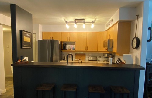 Okanagan-Similkameen House | A Snow-Bird friendly complex, primary bedroom on the main floor.
