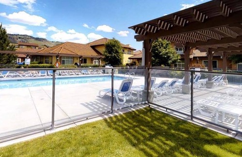 Okanagan-Similkameen House | A Snow-Bird friendly complex, primary bedroom on the main floor.
