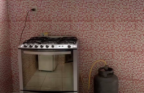Araruama House | A street by the bus station, with air conditioning.