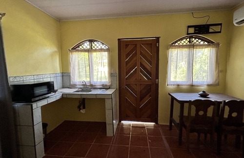 Palma Apartment | A studio cabin with AC and WiFi. in a Tropical Paradise setting.