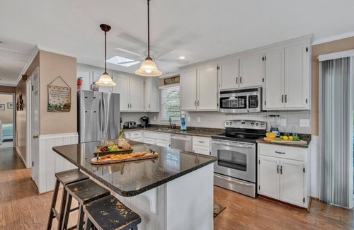 Westlake Corner House | All Decked Out-Features a game room, ping-pong table, large-screen TV and kayaks!