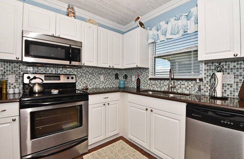New Smyrna Beach House | "All Decked Out NSB" Ocean Views, Private Fenced Yard, BBQ, Bikes, Beach toys