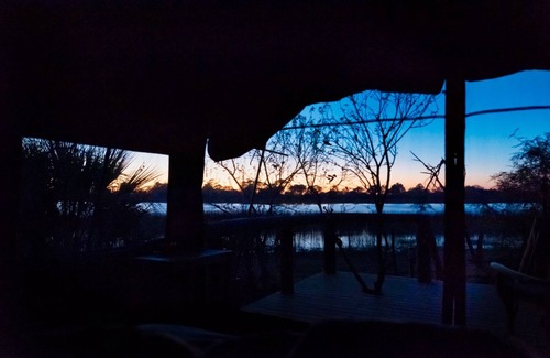 Maun Cabin | Amazing view on the river from your tent to the Okavango Delta
