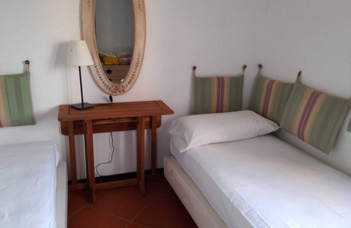Capo Ferro House | Apartment with sea view 30 meters from the beach of Cala del Faro