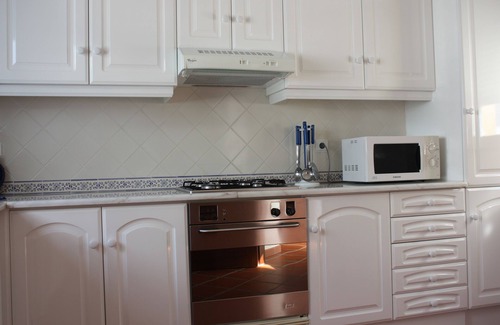 Praia del Rei Apartment | Apartment With Shared Pool, landscaped gardens, Wi-fi