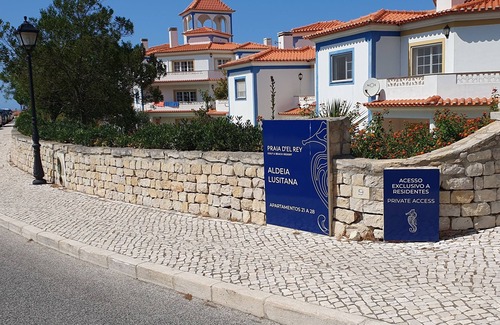 Praia del Rei Apartment | Apartment With Shared Pool, landscaped gardens, Wi-fi