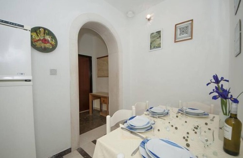 Pucisca Apartment | Apartments Kalajzic - Two Bedroom Apartment with Garden and Terrace(A2) (ST)