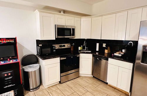 Chinatown Apartment | Arcade 2BR Apt in Walk-up w Laundry