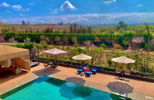 Tahanaout Villa | AUBERGE KENZA Villa farm hosting heated pool view of the Great Atlas