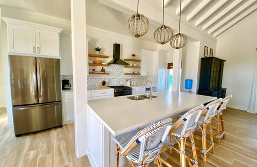 North Palmetto Point House | AZURE: Banks Rd Luxury Beachfront Home with heated pool & backup generator.