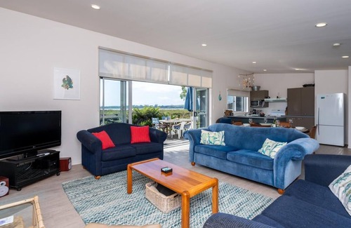 Mangawhai House | Back Bay Beauty - Sunny, pet-friendly kiwi bach with lovely estuary views and access