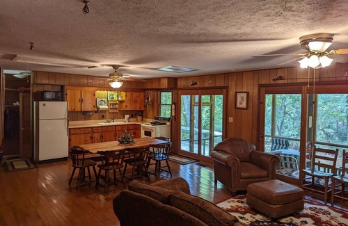Harrisonville Cabin | Backyard creek, screened porch