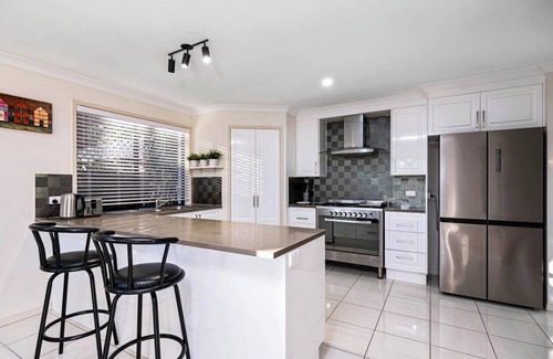 Capricorn Coast House | Beach Sitting @ Mulambin is a spacious holiday home.