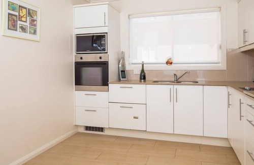 Denhams Beach Apartment | Beautiful and private apartment with large deck on Denhams Beach.
