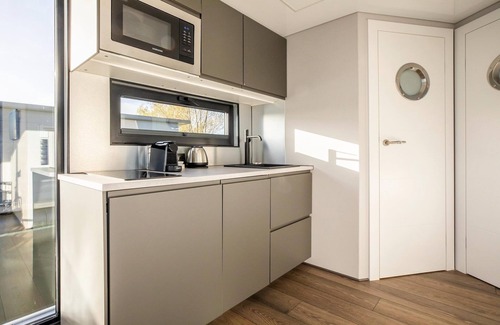 Volendam Boat Rental | Beautiful houseboat with shared pool
