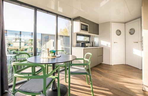 Volendam Boat Rental | Beautiful houseboat with shared pool