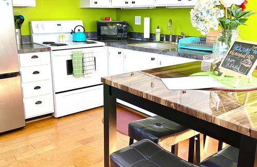 University Park Apartment | Boutique Studio Apartment Hotel across from CSU in Old Town Fort Collins!Take a trip back in time to when Hippies, Coffee Houses, and The British Invasion were everywhere! It's an urban-industrial studio, a rustic garden suite, and our pet-friendly c