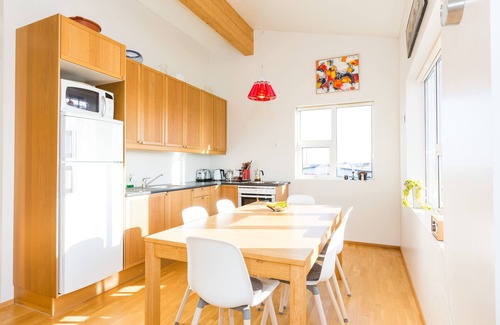 Stokkseyri Apartment | Bright & stylish flat with modern art, big balcony & hot tub. Family friendly.