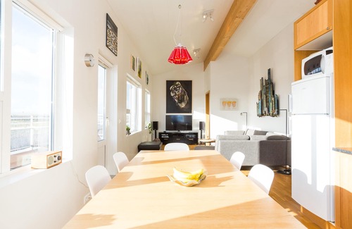 Stokkseyri Apartment | Bright & stylish flat with modern art, big balcony & hot tub. Family friendly.