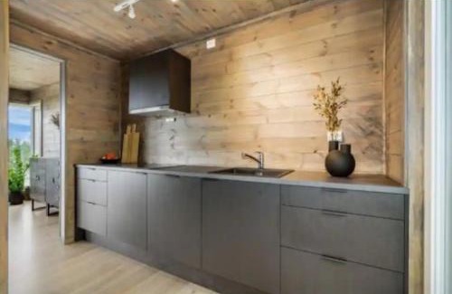 Aure House | Cabin at the end of Skardsøya towards the sea - boat