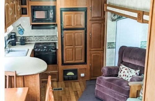 Burks Fork Cabin | Camper in middle of farm setting with creek view