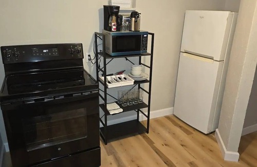 Fayette Condo | Carriage House by CMU - Upper Condo - Kitchen, King Bed, 65" TV Fast WiFi & AC