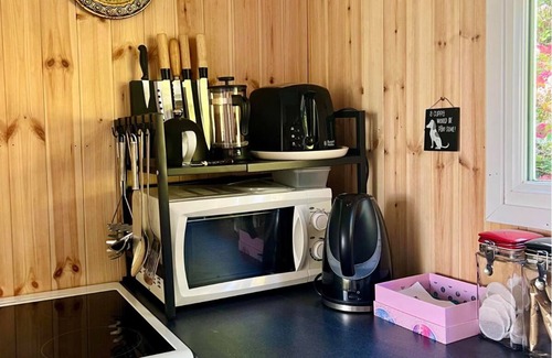 Bryn-crug Ski Chalet | Cedar Chalet in Snowdonia Wales. Stunning Woodland Views & Pool, Family & Pets