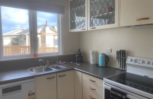 Waitarere Beach House | Central and spacious Waitarere Beach 3 Bed, 2 Bathroom house with sea views