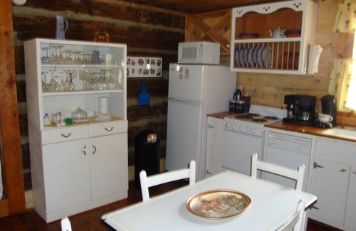 Pittsboro House | Century old log cabin on 62 acre estate