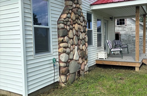 Ellsworth House | Charming 2-bedroom house on acreage in Ellsworth with stone fireplace and WiFi