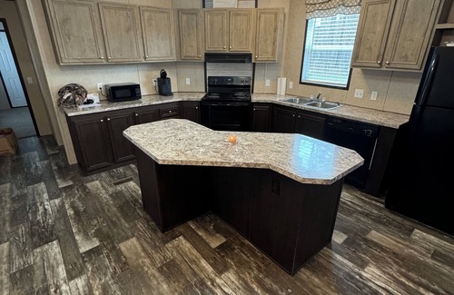Bastrop House | Charming 3-bedroom mobile home in a peaceful country setting.