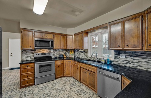 Topeka House | Charming 4BR family home w/private deck off master, big yard and patio