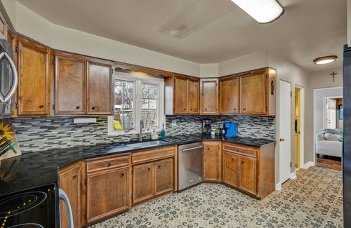 Topeka House | Charming 4BR family home w/private deck off master, big yard and patio