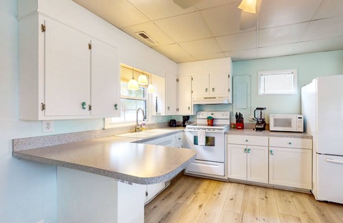 Cherry Grove Beach House | Charming house with hot tub, W/D, dog friendly & close to beach