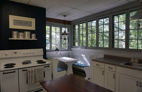 Burdett Cottage | Charming lakefront cottage with private beach and boat dock.