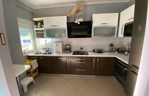 Ishem Villa | Cheerful 4-bedroom villa with indoor fireplace.