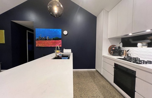 Hobsonville House | Chic, modern designer oasis on city fringe with large spa pool. Great kitchen!