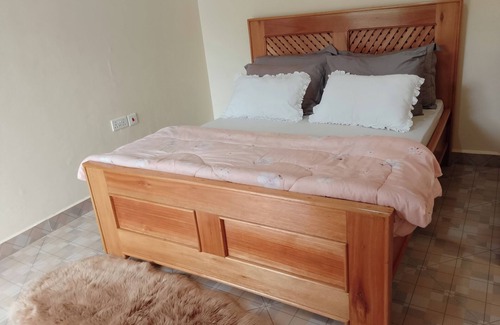 Moshi Bed & Breakfast | Chill in Style — Your Perfect Stay at Hellens Riverside Villas-KIBO WING Awaits!