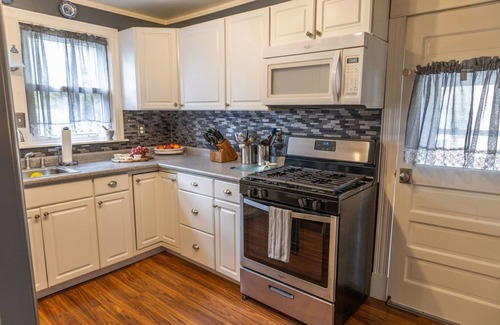 Portland House | Classic Maine home in quiet tree-lined street neighborhood with fenced in yard